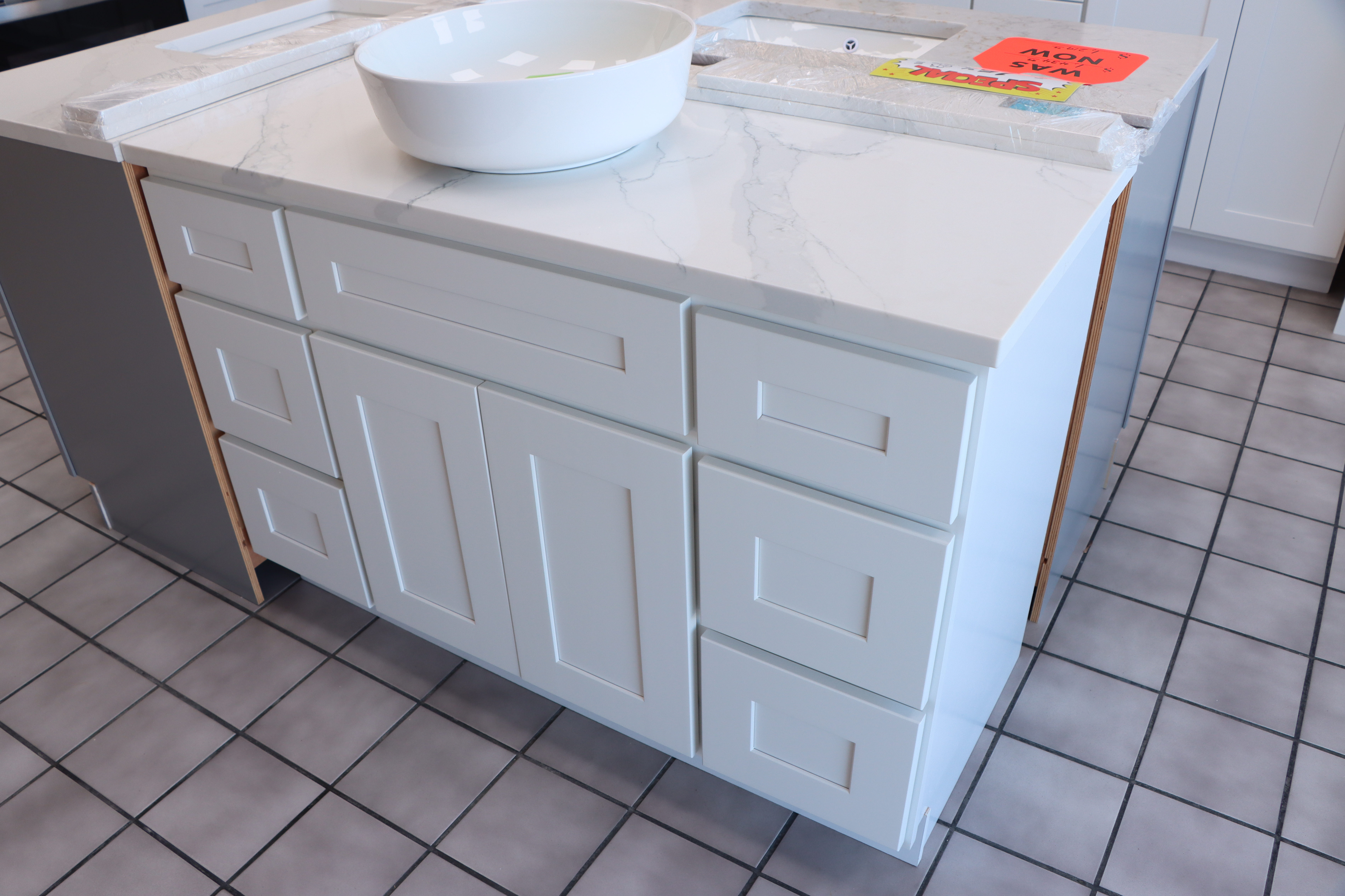 White bathroom vanity display with countertop